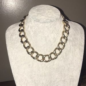 Gold tone chain link necklace.